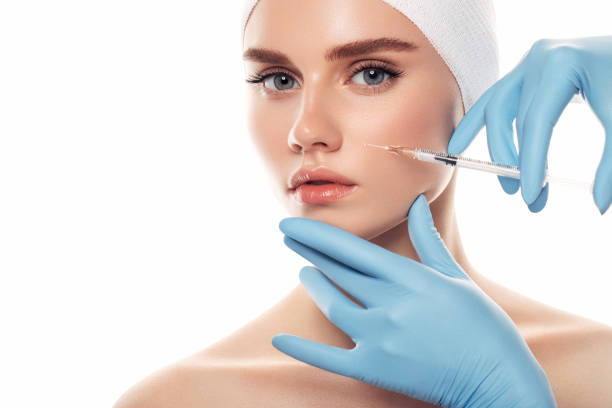 Woman having facial injections Woman having facial injections botulinum toxin injection stock pictures, royalty-free photos & images