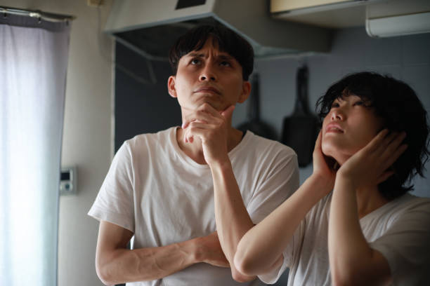 istock Couple suffering from noise upstairs 1289366699