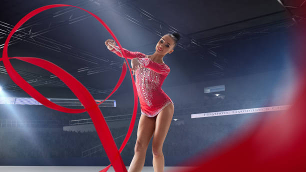istock Rhythmic gymnast in professional arena. 1289366844