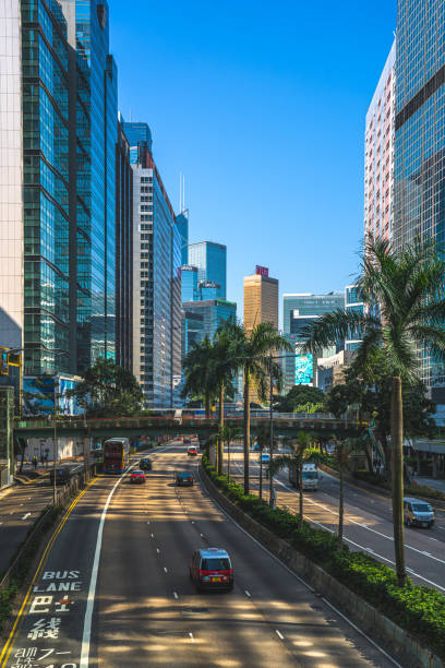 istock Hong Kong traffic zooming through skyscraper avenue 1289367788