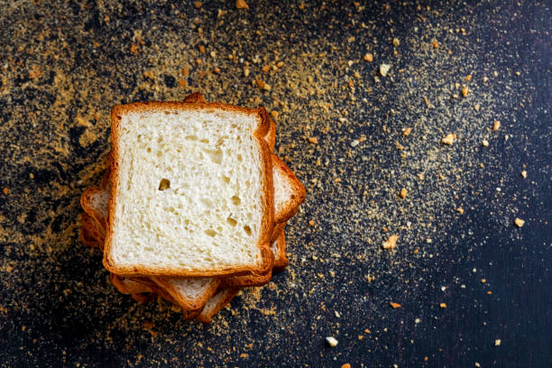 istock Cut of loaf bread on white against white background 1289368906