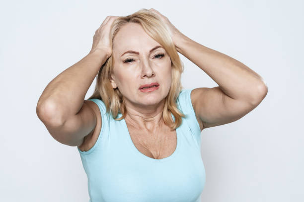 istock A woman has a headache. 1289369347