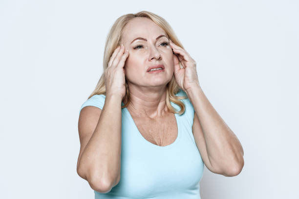 istock A woman has a headache. 1289369387