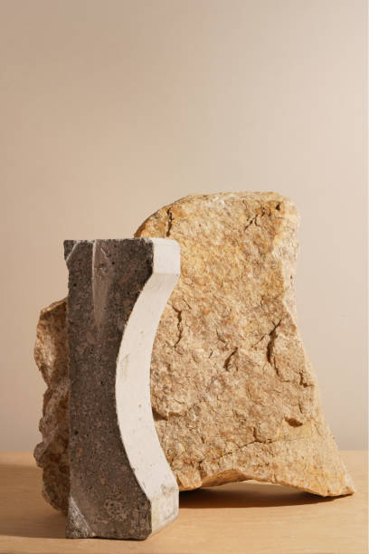 istock Stone and a piece of tile podium on a beige background 1289369432