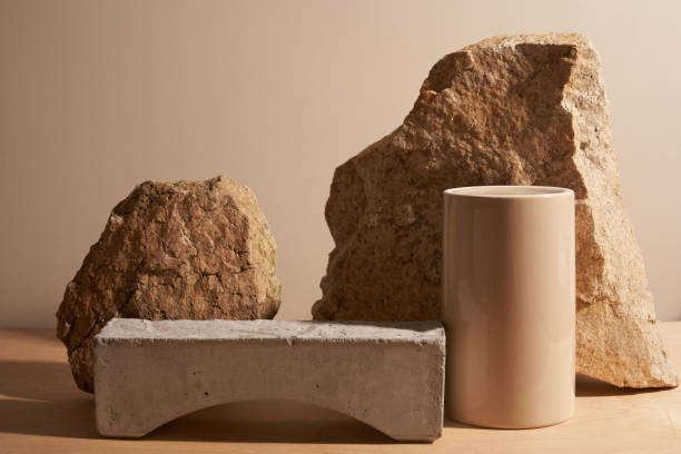 istock Stone and a piece of tile podium on a beige background 1289369442