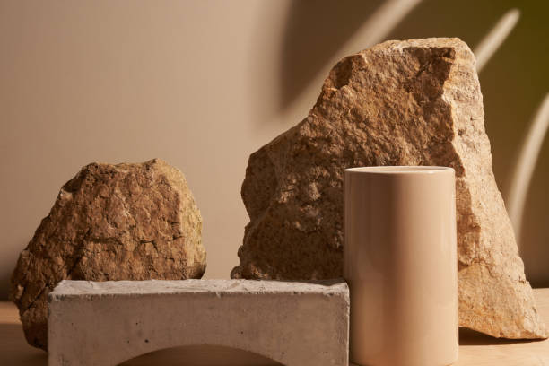istock Stone and a piece of tile podium on a beige background 1289369444