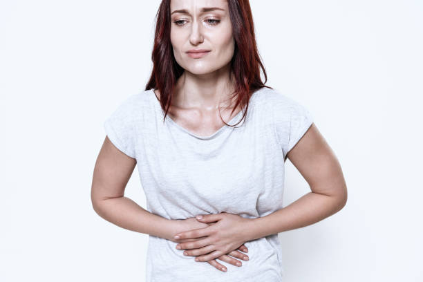 istock A white woman has a stomach ache. 1289369530