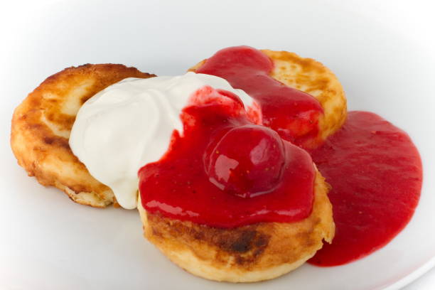 istock Cheesecakes with sour cream and cherry sauce 1289369780