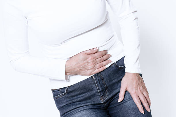 istock A white woman has a stomach ache. 1289369848