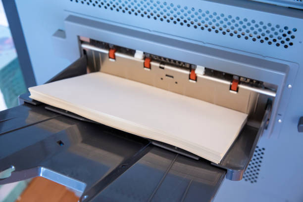 istock view of a stack of paper lying on a paper printing machine 1289370910