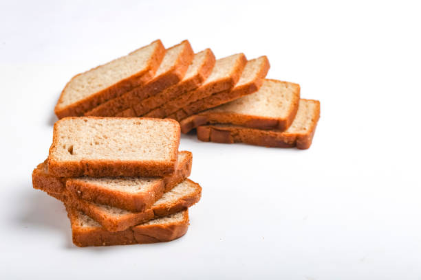 istock Cut of loaf bread on white against white background 1289370996