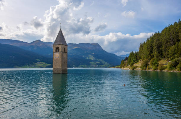 The bell tower of the sunken church in Curon, Resia Lake, Bolzano province, South Tyrol, Italy. stock photo