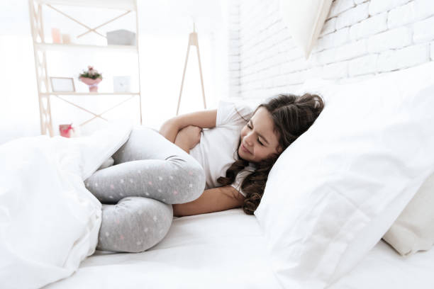 istock The girl has a stomach ache. 1289371518