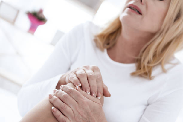 istock A woman has a knee pain, she is doing a massage. 1289371688