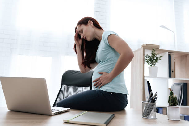 istock A white pregnant woman has a stomach ache. 1289373430