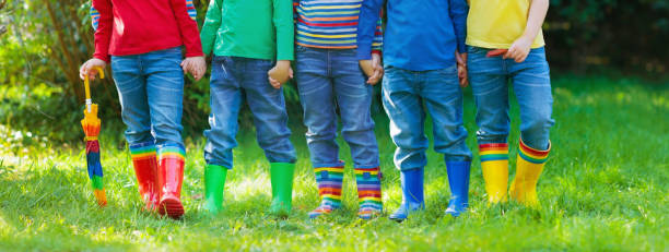 istock Kids in rain boots. Rubber boots for children. 1289373769