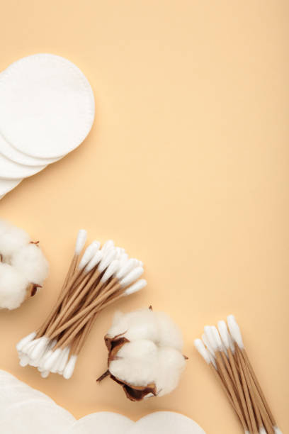 istock Cotton swabs and sticks with flower on beige background 1289375921