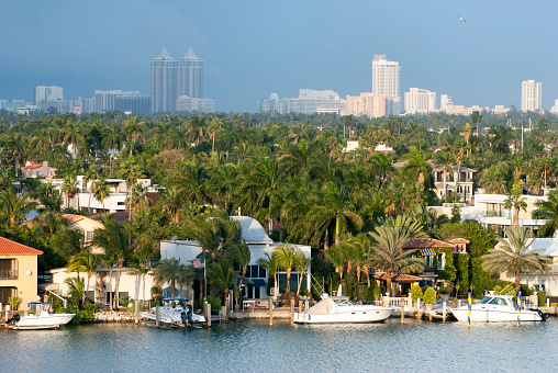The view of artificial residential Palm Island with moored motorboats and luxury mansions (Miami, Florida).