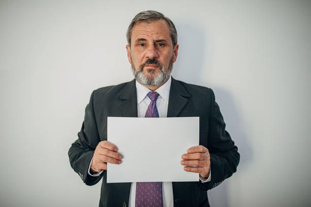 istock Businessman arrested, police lineup 1289380277