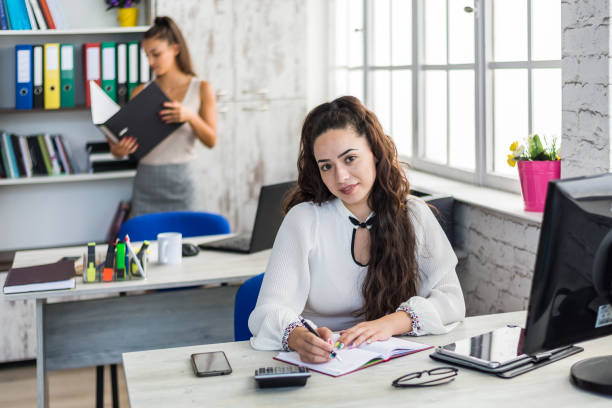 istock Two women working in an office 1289380559
