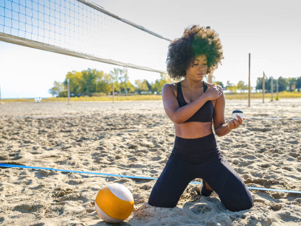 istock African woman applying cream after sport activity 1289383748