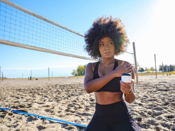 istock African woman applying cream after sport activity 1289383755