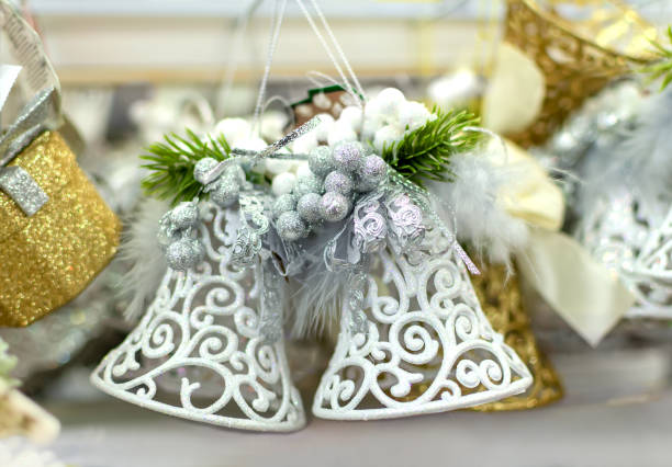 istock white christmas bells on a light blurred background 1289384622