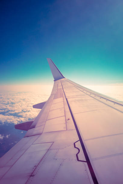 istock Inspiration view from the plane window on the wing, sky and clouds 1289387279