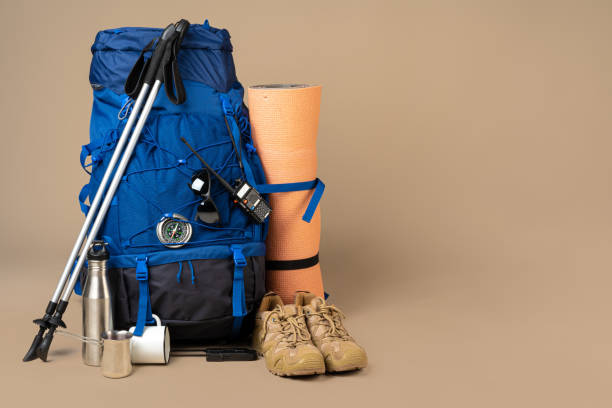 istock Blue backpack and hiking boots. Mountain gear close up 1289388493