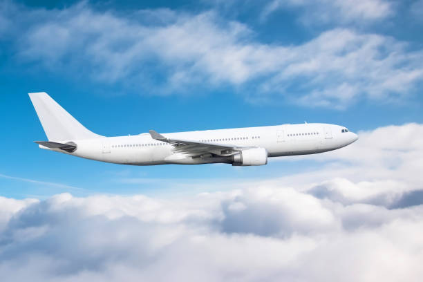 istock Flying a aircraft over fluffy cumulus clouds, aerial view. 1289388674