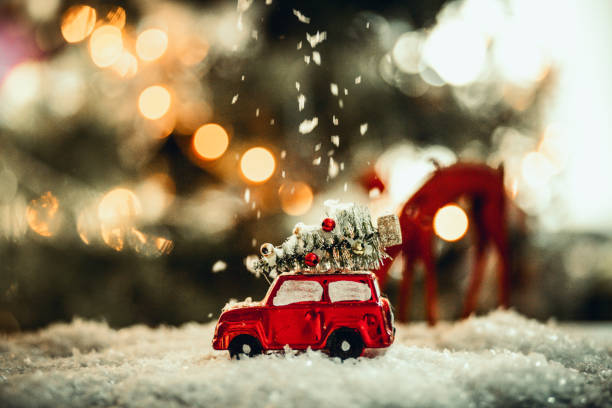 decorated retro red car with festive new year lights - winter driving imagens e fotografias de stock