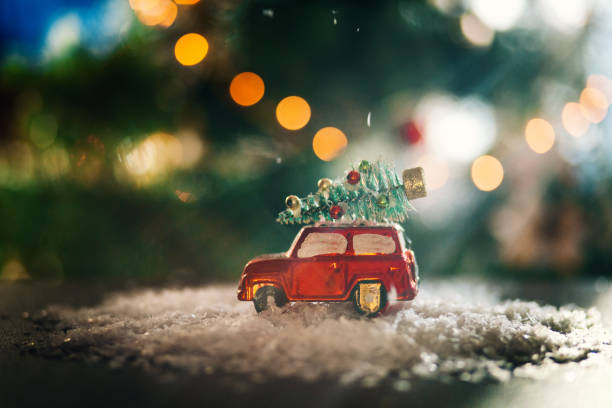 istock Decorated retro red car with festive New Year lights 1289389519