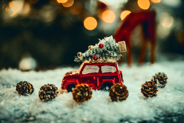 istock Decorated retro red car with festive New Year lights 1289389622