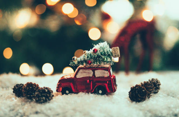 istock Decorated retro red car with festive New Year lights 1289389831