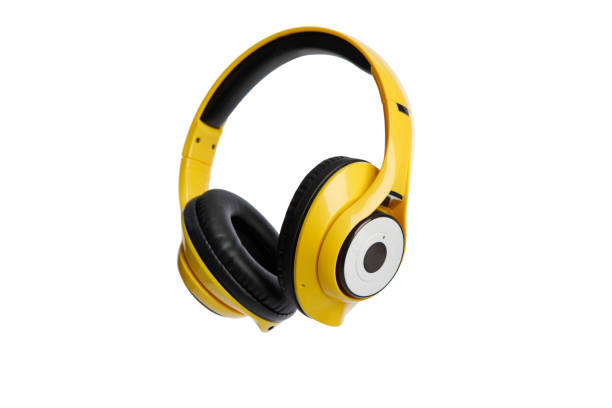 istock Yellow wireless headphones isolated on white background 1289392584