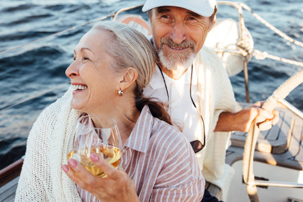 istock Smiling elderly couple enjoying vacation on a private yacht 1289392861