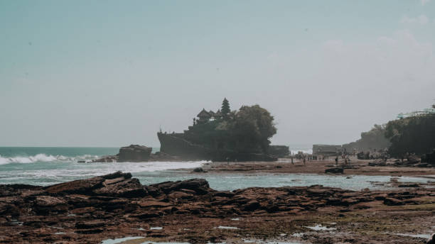 istock rocky beach with a temple in the background in bali 1289393047