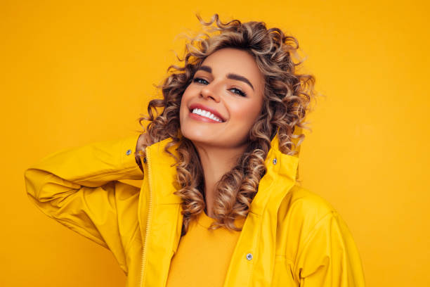 istock Young beautiful girl wearing raincoat 1289402790