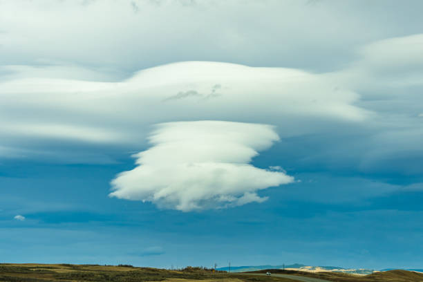 istock Cumulonimbus cloud in bule sky over country road 1289403498