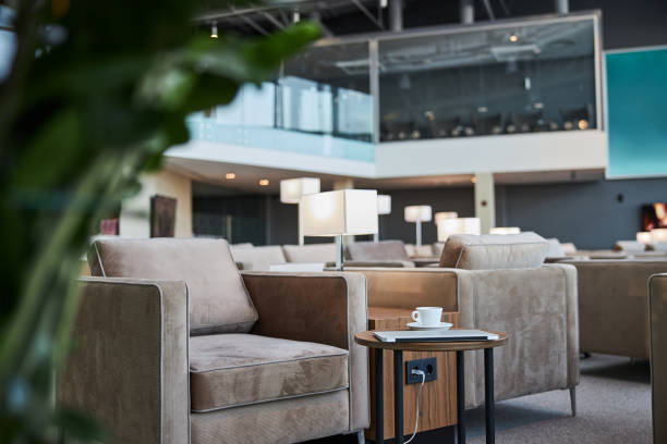 istock Charging young gadgets and drinking coffee in the lounge zone 1289407969