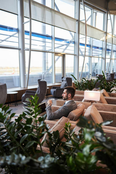 istock Spacious airport lounge zone with only one visitor 1289408009