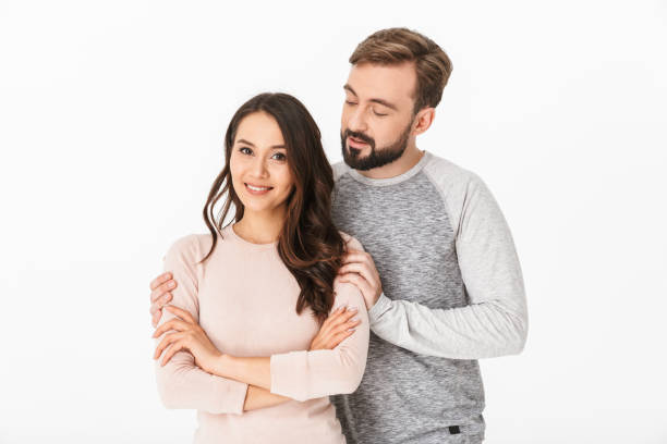 istock Cheerful young loving couple isolated 1289408735
