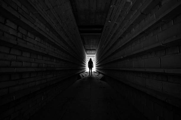 istock tunnel silhouette in the darkness 1289409874
