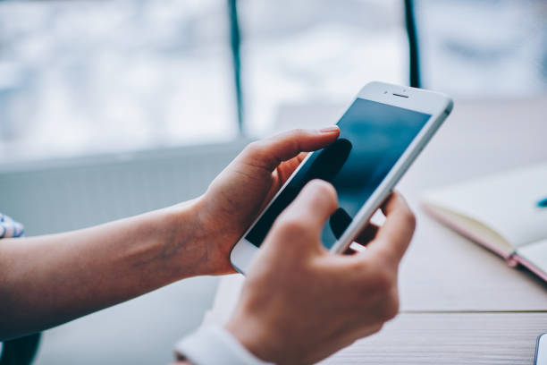istock Faceless person messaging on smartphone 1289410225