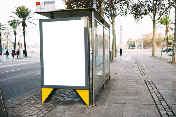 istock Bus stop with banner in tropical city 1289410258