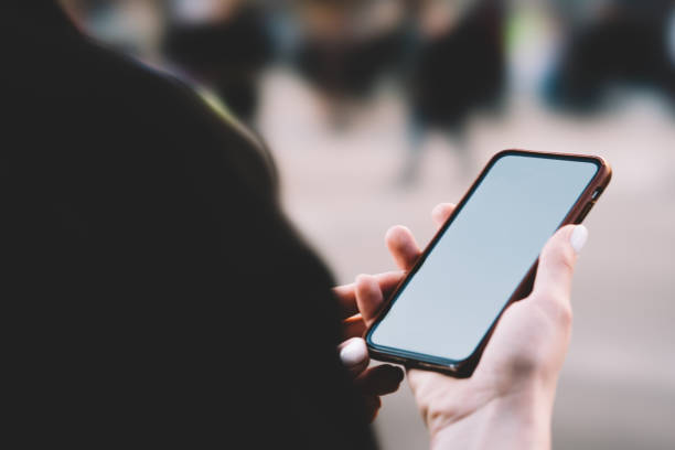 istock Anonymous woman checking mobile phone 1289410260