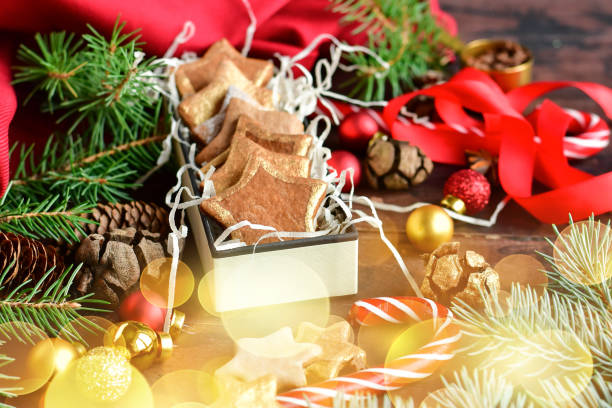 istock Christmas cinnamon star cookies and festive shiny decorations 1289410545