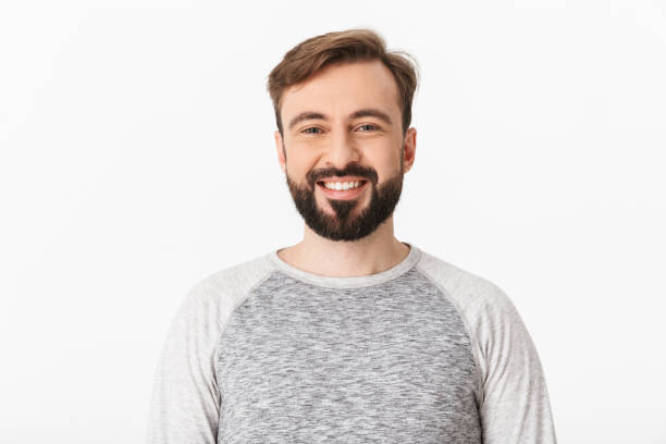 istock Cheerful young man isolated over white wall 1289410568