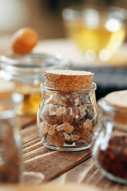 istock Glass jar of sweetener on wooden table 1289411708