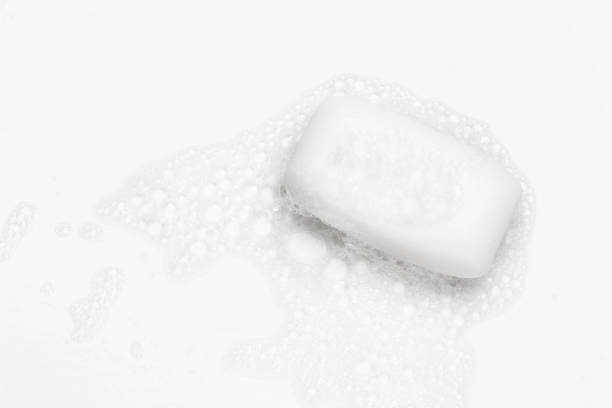 istock Soap bar and foam on white background, top view. Mockup for design 1289412606